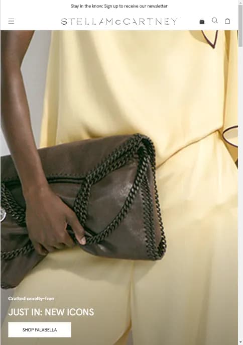 Close-up of a person holding a dark brown leather handbag...